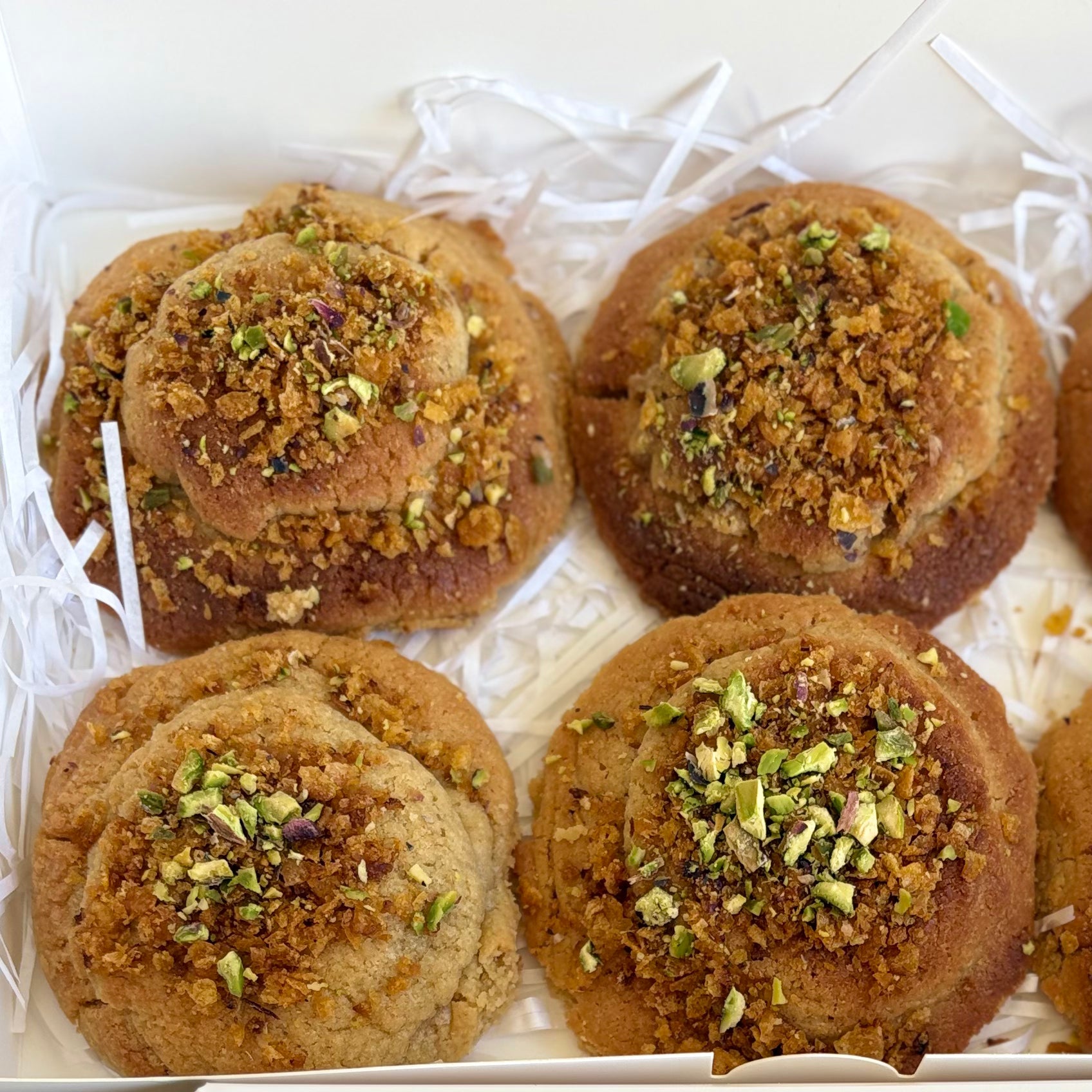 Kanafe cookie with a creamy filling and pistachio topping