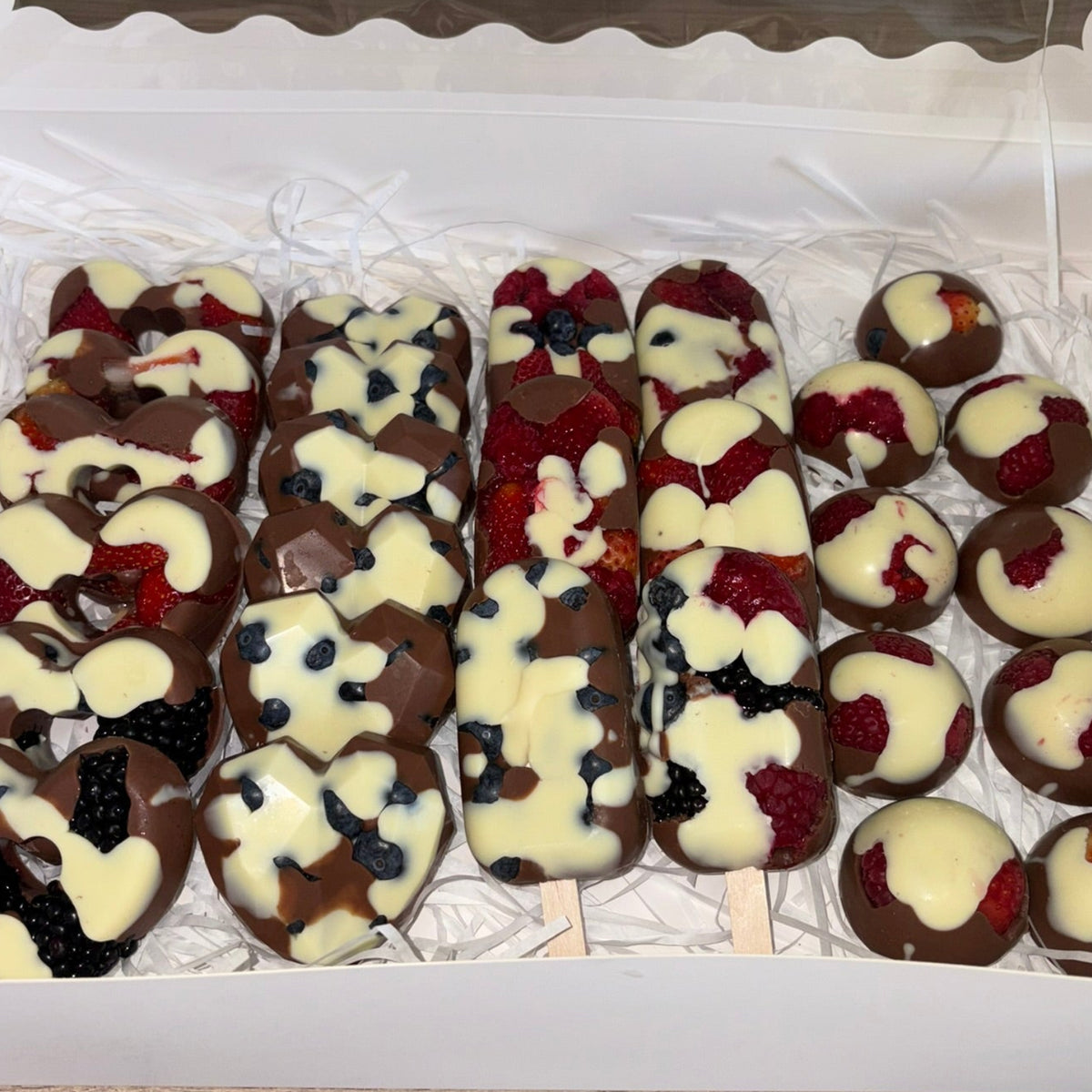 Ultimate Fruit Collection gift box with assorted chocolate-covered fruit treats.